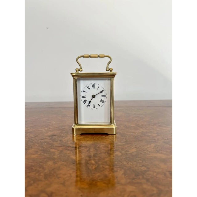 Antique Victorian quality French brass carriage clock having a quality brass case with bevelled glass, white enamel dial...