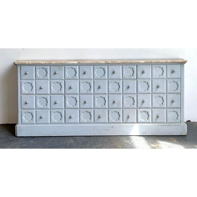 This monumental vintage credenza is a masterclass in Hollywood Regency glamour, artfully blending Neoclassical...