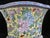 Chinese porcelain cache pot with porcelain stand. Vibrant blue, pink, and red flowers on yellow backdrop. Four rounded...