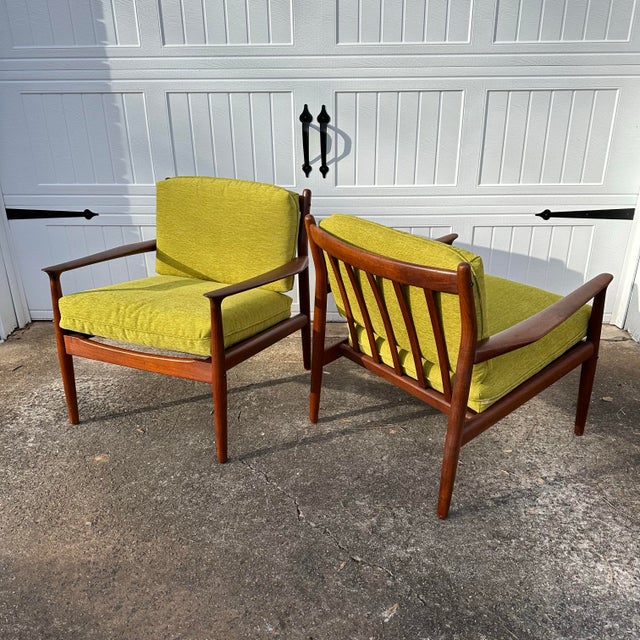 A splendid pair of model GM-5 Danish lounge chairs by Svend Aage Eriksen in solid teak with a new lime upholstery with...