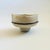 A vintage ikebana pottery bowl on a pedestal base. Lovely off white crackle glaze with textured gray band wrapping around...