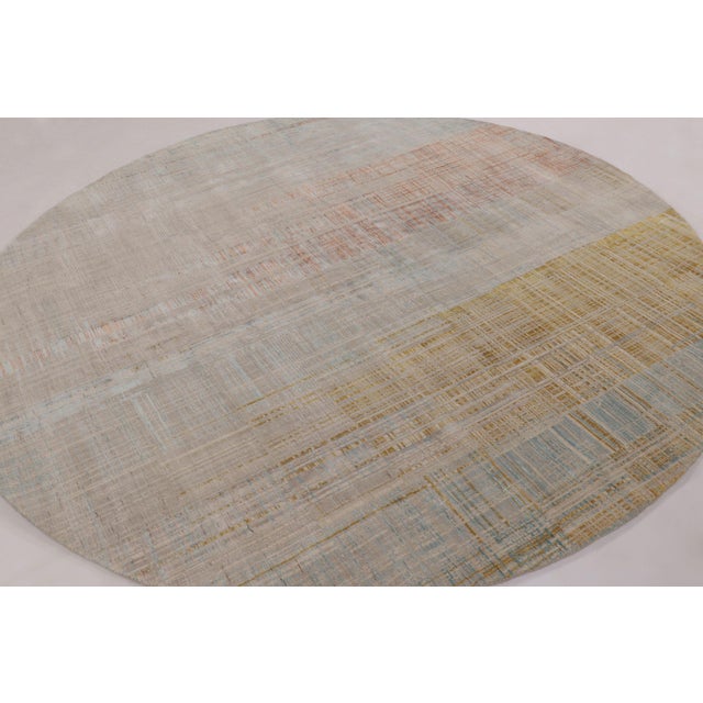 Hand-knotted in a sophisticated blend of wool and silk, this 8x8 circle rug is a luxurious addition to Rug & Kilim’s...
