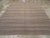 This Mid-20th century Turkish Flatweave Kilim rug, features a refined horizontal striped design woven in a palette of...