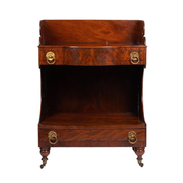 An American demilune dressing stand, its projecting top framed by a three-sided splash in the Neoclassic style. Flanking...