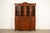 A beautiful Georgian or Federal style breakfront bookcase cabinet with drop front secretary desk In the manner of Baker...