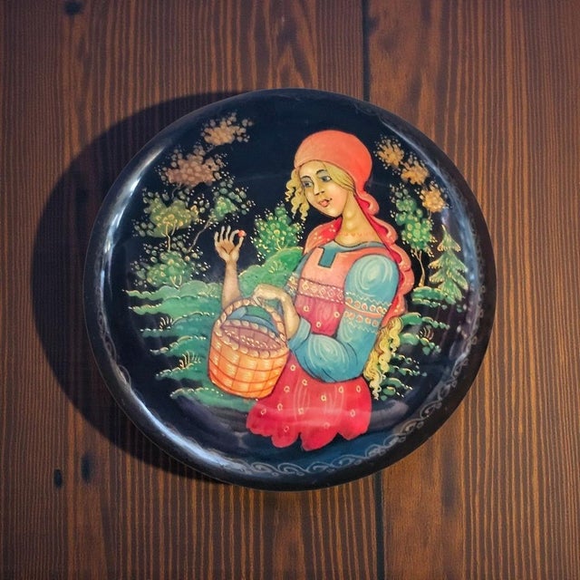 Hand painted Russian lacquer miniature trinket box in the Palekh tradition, depicting a berry gathering scene rendered on...