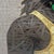 The artwork features a profile of a figure adorned with lush, textured hair intertwined with vibrant butterflies and...