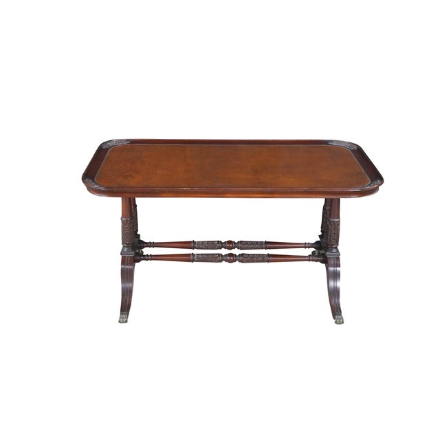 A striking 1940s Cocktail table by Imperial Furniture of Grand Rapids, Michigan. Drawing inspiration from Duncan Phyfe and...