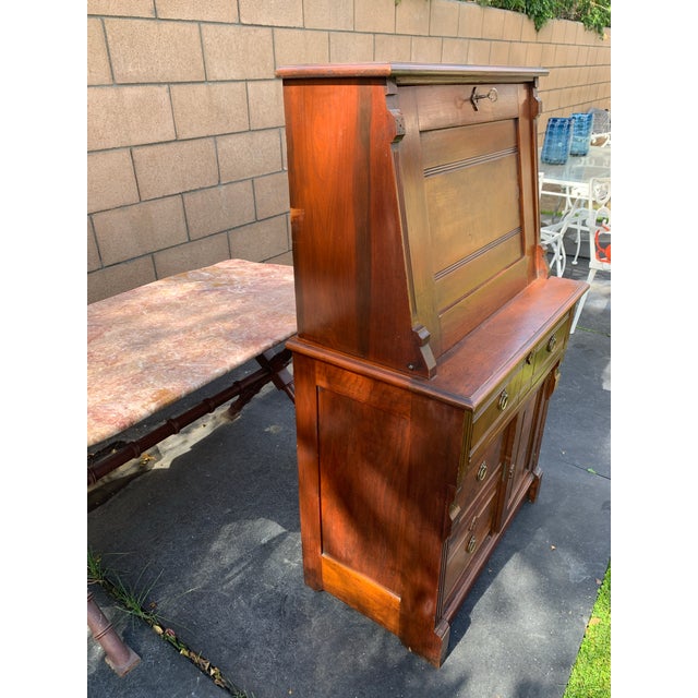Here we have a darling antique Victorian drop front secretary desk. A charming piece on the petite side at 29 inches wide,...