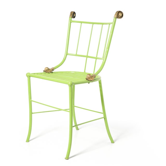 Iron 1930s chair decorated with gilt scrolls and dolphin details and bright green enamel original paint. 4 available...