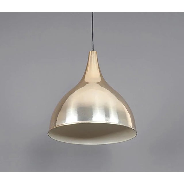 Elegant organically shaped metal hanging lamp designed by Jo Hammerborg. Model Silhouettete, produced by Fog & Morup in...