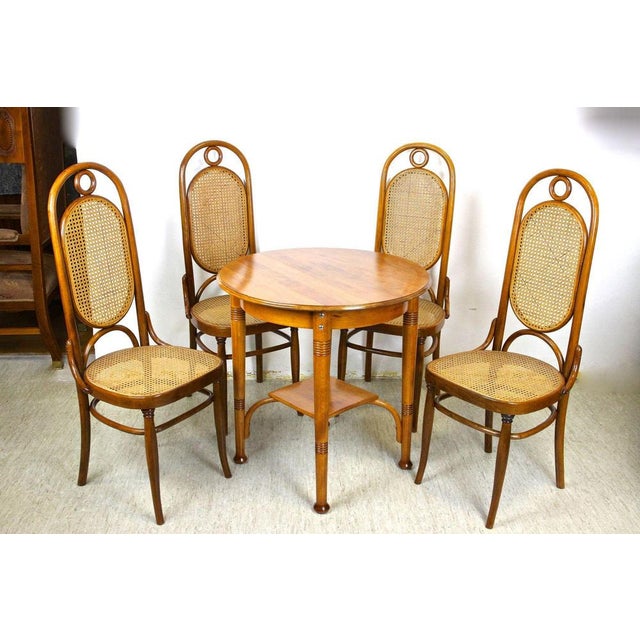 Beautiful bentwood seating set made by the famous Austrian manufactory of Thonet around 1915. This artfully processed Art...