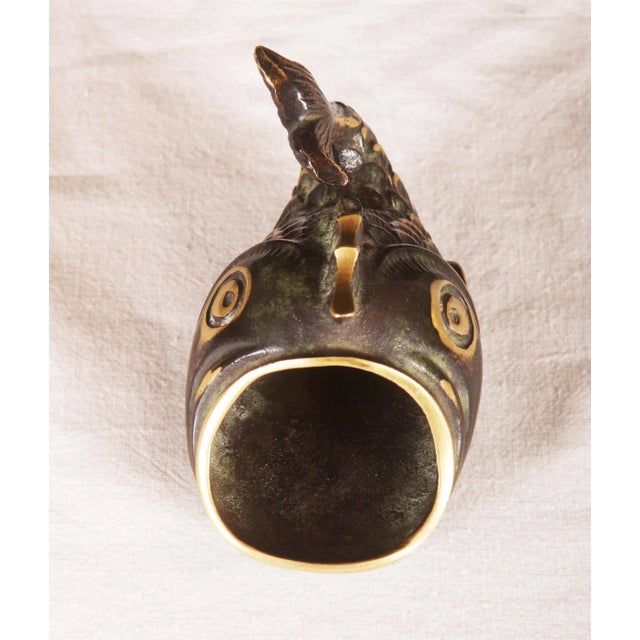 This ashtray is made from blackened brass in the shape of a fish. It is in very good vintage condition.