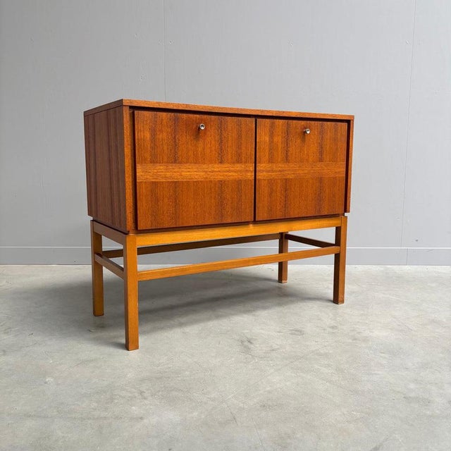Remarks: Small German 1960s sideboard / cabinet. Teak veneer. Cabinet is in very good condition. Measurements: Height: 70...