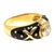 Late 20th Century ring by Hidalgo, featuring a bezel set round brilliant-cut diamond in an 18k yellow gold and black...