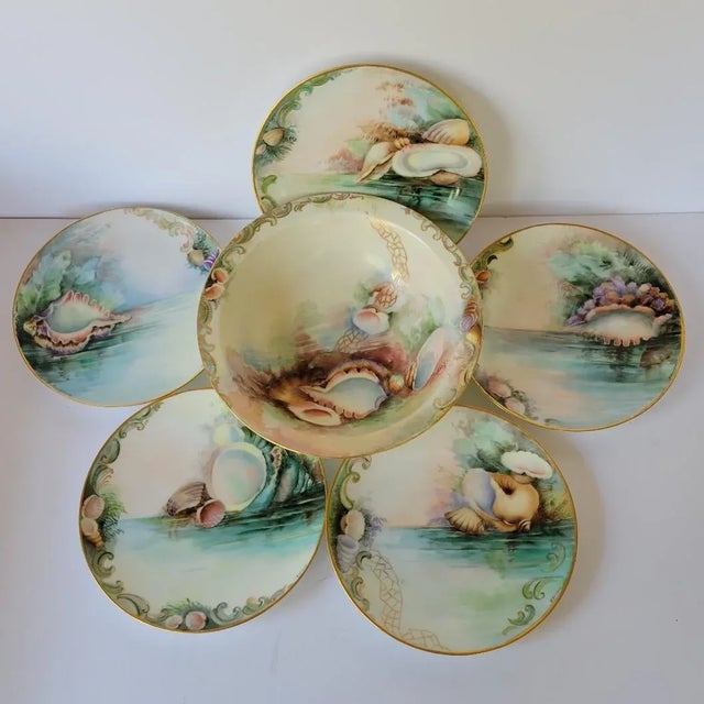 Circa 1910, hand painted with a lovely sea shell motif and artist signed, we are offering this rare set of five 7.5"...