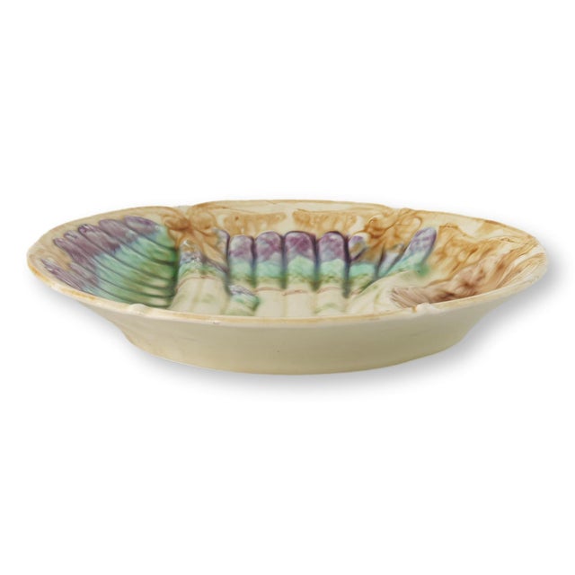 Late 19th century French asparagus serving plate featuring richly molded barbotine decoration with vibrant green and...