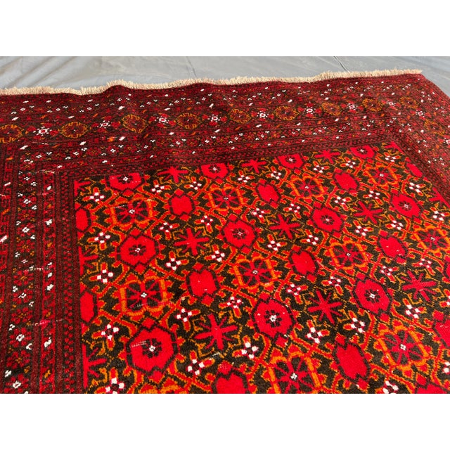 Welcome! This vintage Turkmen Bashiri rug features a stunning geometric tribal design, with vibrant red, brown, and black...