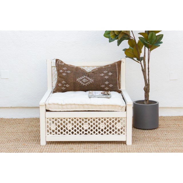Inspired by ancient Moorish architecture, our custom Jali club chair features a finely carved see-through floral panel...