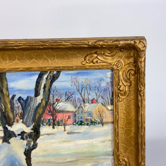Original oil painting signed "Millie Housel" lower right: winter village scene with a large snow-banked tree in the...