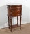 All -sided drum table, in solid and plated mahogany, summoned with a turquin marble of built -in colves. She is stamped...