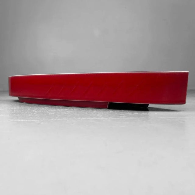 Elegant Japanese ikebana bowl from the 1950s, finished in a deep, glossy red glaze. Dimensions: height 8 cm, width 53 cm,...