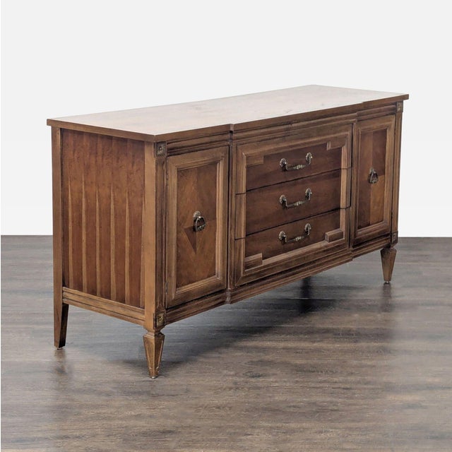 This Thomasville Italian Mediterranean style sideboard offers a timeless look with sturdy wood construction. It features...