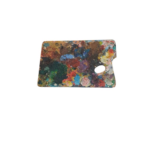 Vintage wooden artist pallette with heavy oil paints in various colors mixed throughout. Acquired from a Palm Beach estate
