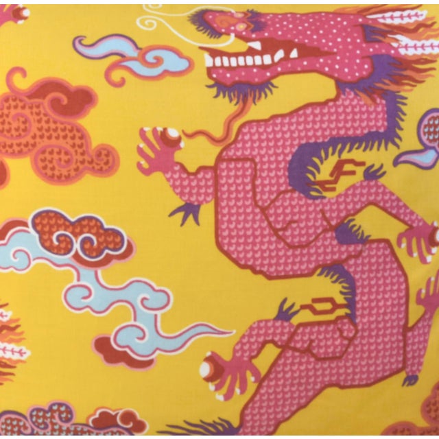 This pillow features Magical Ming Dragon by Johnson Hartig/Libertine for Schumacher. Hand-printed, stylized dragons are...