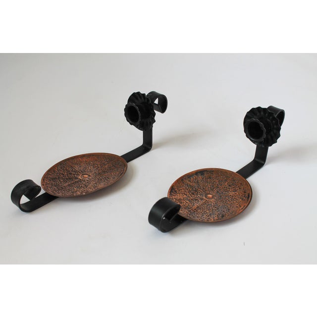 Pair of vintage copper and painted black metal candle wall sconces. No makers mark. Some light age wear to painted black...