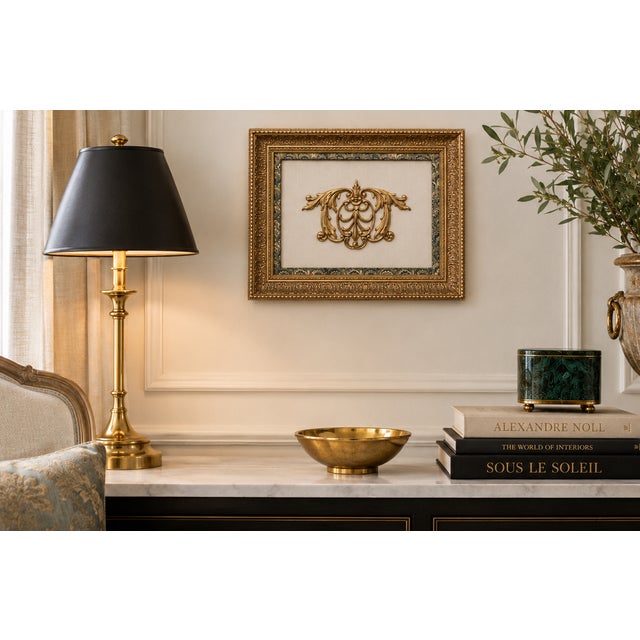 Decorative wall plaque in the Baroque taste featuring an elaborate gilt acanthus and C-scroll cartouche with central...