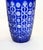 An attractive pair of tall cobalt blue glass vases with gently tapering bodies and circular rims The rich blue surface is...