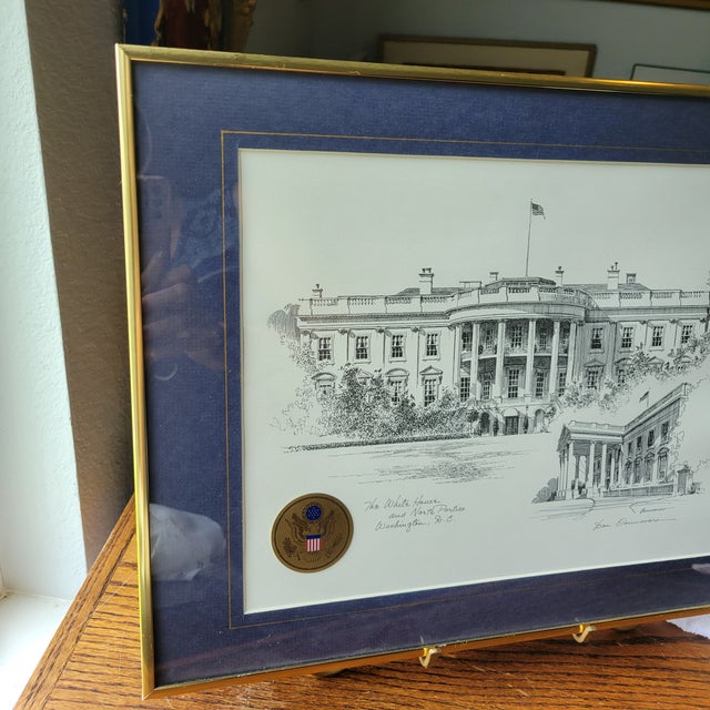 This product is a framed and signed lithograph by artist Don Cannavaro featuring a landscape view of The White House and...