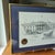 This product is a framed and signed lithograph by artist Don Cannavaro featuring a landscape view of The White House and...
