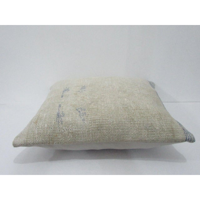 Decorative pillow cover made from a vintage Turkish handknotted rug. Backed with good quality cotton fabric. Pillow...
