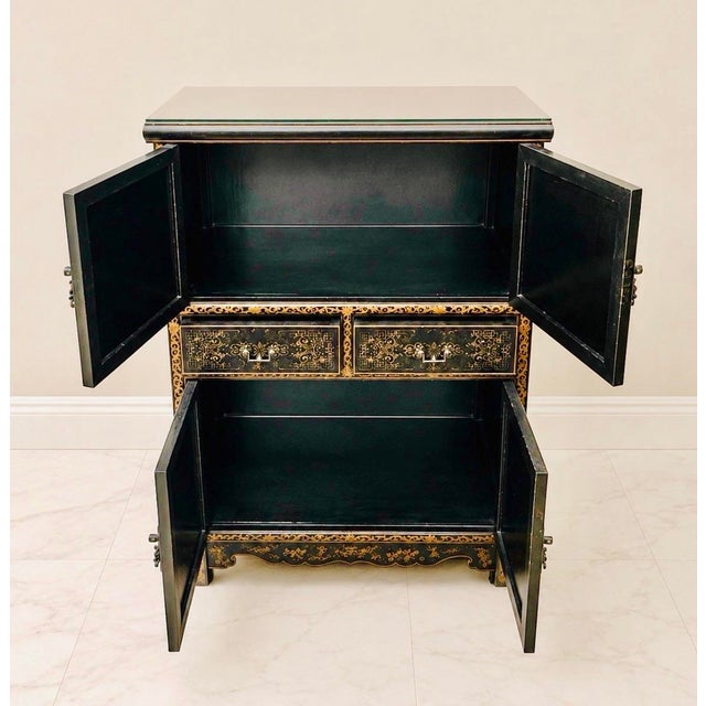 1. Hollywood Regency Asian Revival/Chinese Chinoiserie style cabinet The raised floral and bird appliqués, black lacquer...