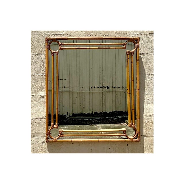 Add a touch of seaside charm to your home with this Vintage Coastal Four Corners Rattan Mirror. Featuring a sturdy rattan...