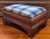 Antique 19th century American Classical foot stool in highly figured tiger maple, circa 1830. Upholstered with blue plaid...