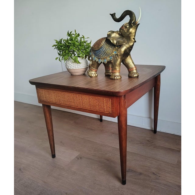 Bring a perfect blend of clean-lined minimalism and warm, organic texture into your home with this stunning rattan vintage...