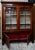 Large Victorian Rosewood Gothic Bookcase. With its moulded cornice above a pair of glazed panel doors with applied trefoil...