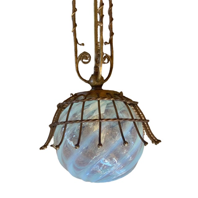 This pendant is truly FABULOUS! Solid brass holder with strong Art Nouveau influence holding the beautiful faint blue...