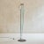 The 'Naos Terra' floor lamp, designed by Carlo Forcolini for Nemo Italianaluce in the 1980s, features a polished chrome...