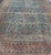 Blue background antique Persian Sarouk rug with red and acid green florals. Keivan Woven Arts / rug L11-0305, country of...