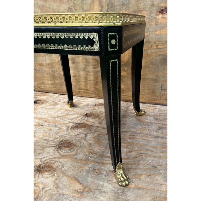Make a bold, sophisticated statement with this Maitland-Smith leather-top occasional/drinks table, a piece that blends...