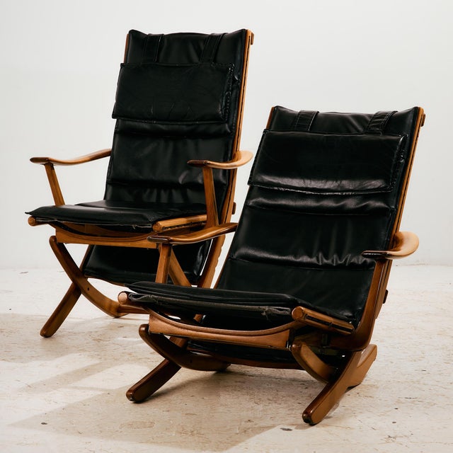 Beech armchair with comfortable leather upholstery from the 1970s. The seat height of the chair is adjustable, so it can...