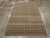 A vintage Turkish Sivas accent rug. Both the abrashed field and border display a small, repeating diamond pattern with...