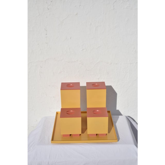 Set of four lidded jars and a tray "euclid" series manufactured by alessi italy,1994 peach colored plastic dimensions...