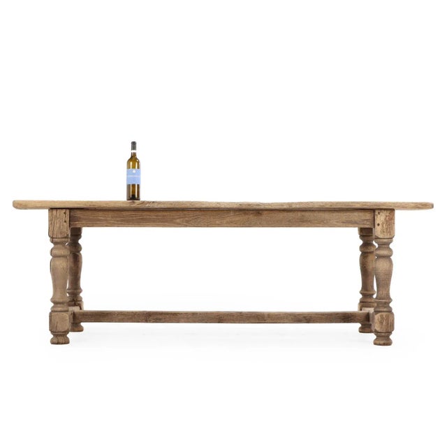 This exquisite French oak farm table, dating to the 19th century, exudes timeless charm and sophistication. The table’s...