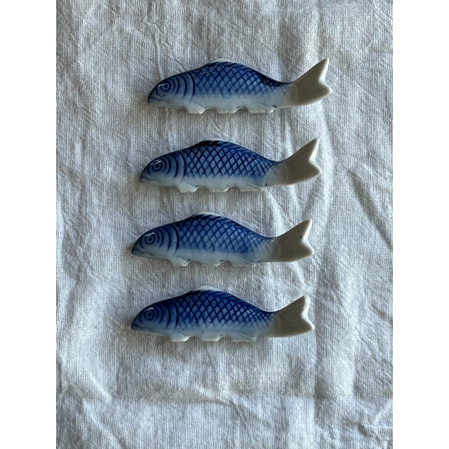 Four blue and white chinoiserie fish chopstick holders. Could also be used for decoration or as an addition to your...