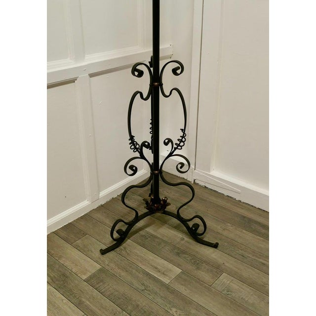 Arts and Crafts Wrought Iron Floor Standing Oil Lamp This is a very attractive piece, the lamp has a decorative wrought...